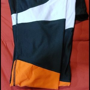 Black, light pink and red accented leggings